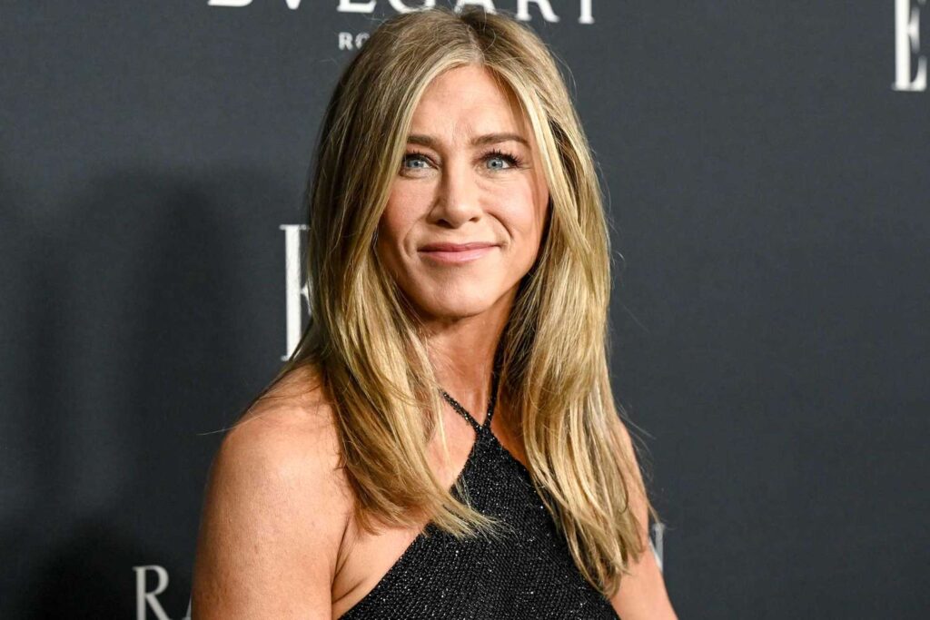 Jennifer Aniston brings back the iconic ’90s vibes her friends gave her, rocking a vintage Ralph Lauren dress
