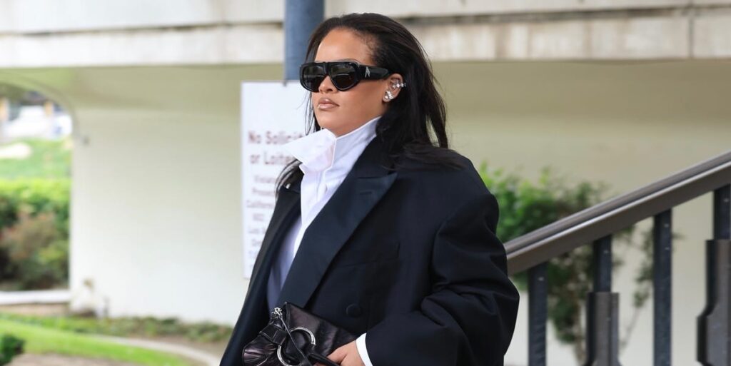 Rihanna steps out in a chic black suit and sculptural blouse