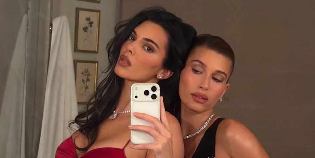 Kendall Jenner and Hailey Bieber appear in two contrasting form-fitting dresses