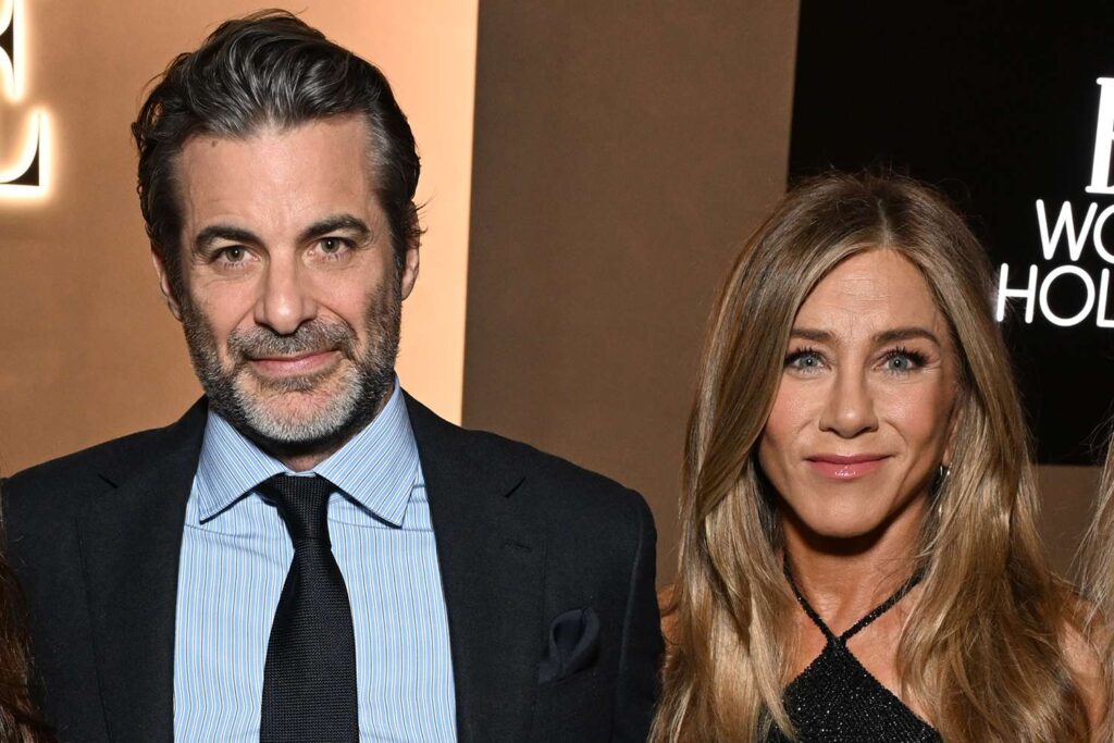 Jennifer Aniston and boyfriend Jim Curtis attend their first public event together