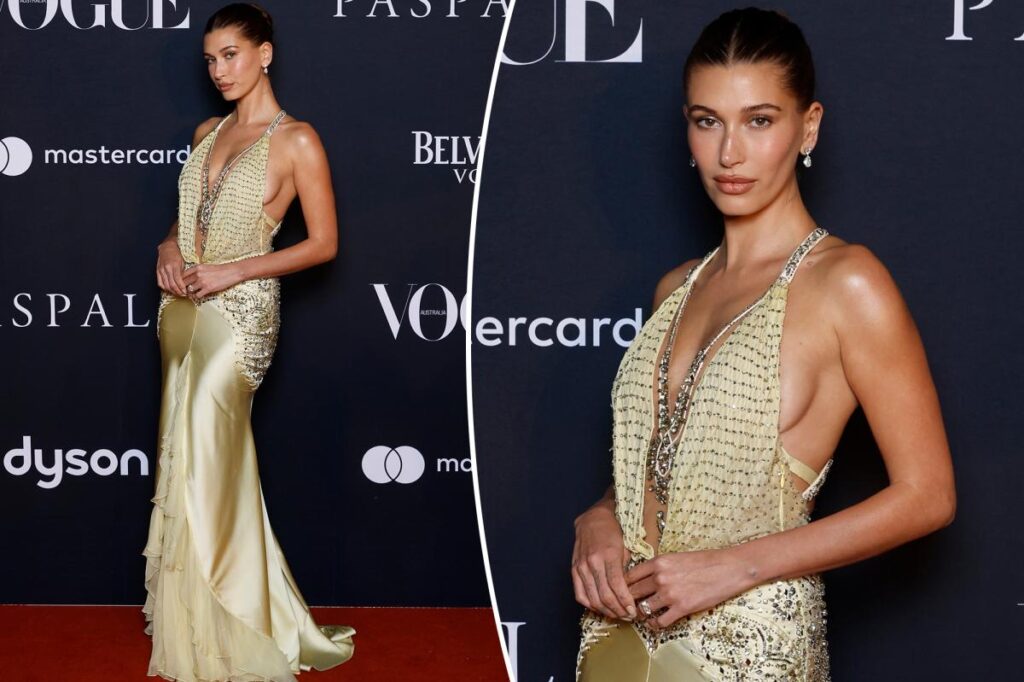 Hailey Bieber wears vintage plunging Versace at Vogue Forces of Fashion in Sydney