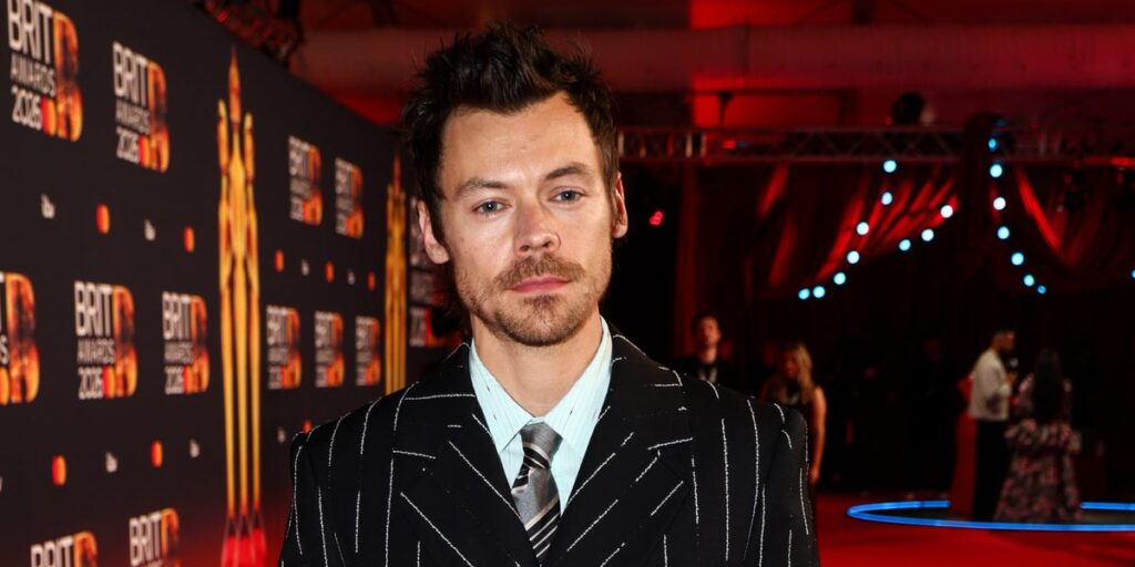 Harry Styles wears Chanel pinstripe suit to BRIT Awards