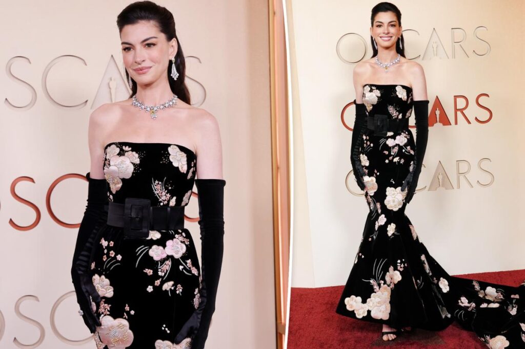 Anne Hathaway wears Valentino floral dress on the 2026 Oscars red carpet