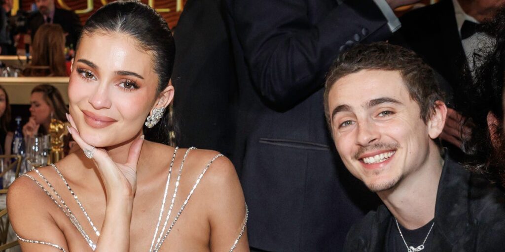 Timothée Chalamet is seen kissing Kylie Jenner while cheering her on at a photoshoot