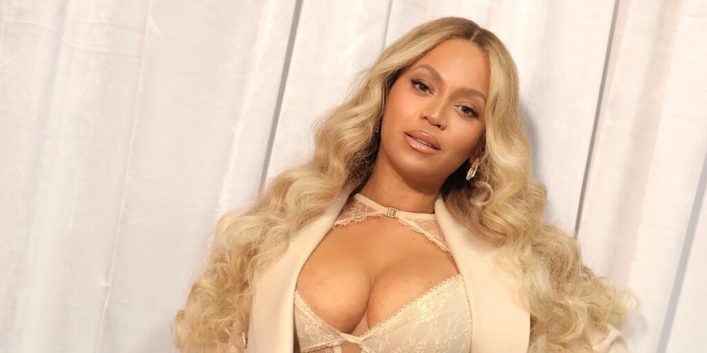Beyonce styles lace corset and shorts for Cécred hair care launch